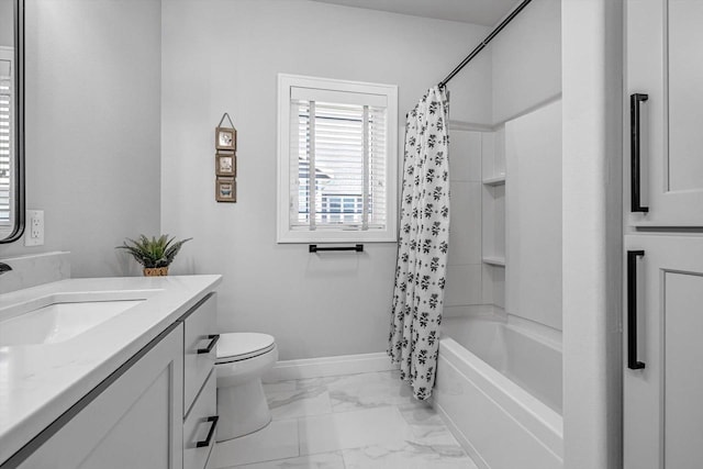 802 Lynn St, Waunakee, WI 53597 - bathroom featuring vanity, shower / bath combo with shower curtain, toilet, marble finish flooring, and baseboards