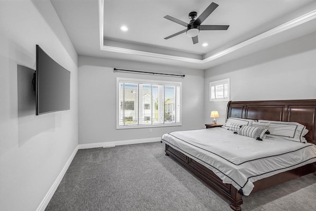 802 Lynn St, Waunakee, WI 53597 - carpeted bedroom featuring a tray ceiling, baseboards, recessed lighting, and a ceiling fan