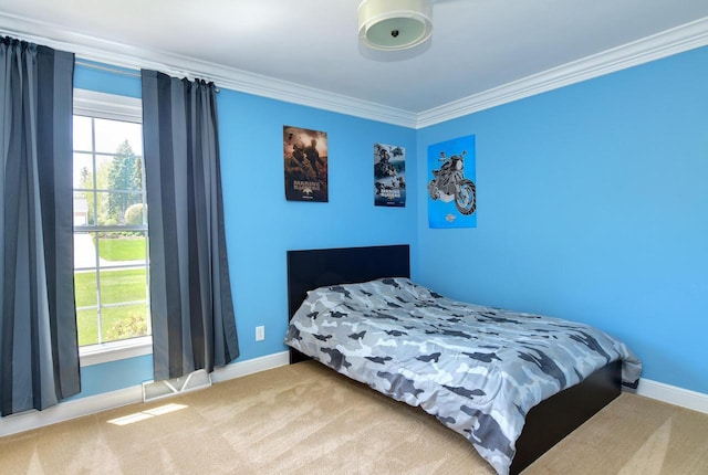 carpeted bedroom with ornamental molding, baseboards, and multiple windows