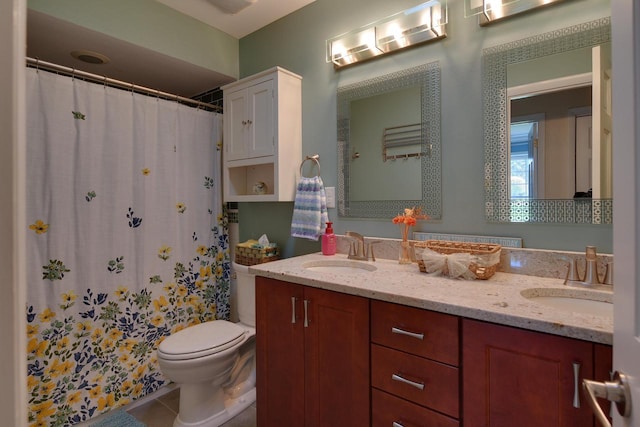full bath featuring toilet, tile patterned flooring, double vanity, and curtained shower