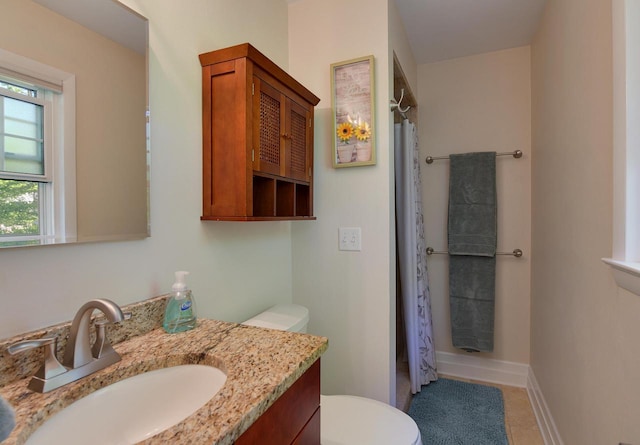 bathroom with toilet, a shower with curtain, vanity, and tile patterned flooring