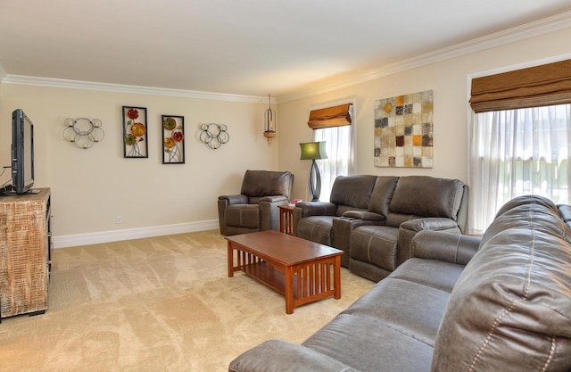 living area with ornamental molding, light colored carpet, and baseboards