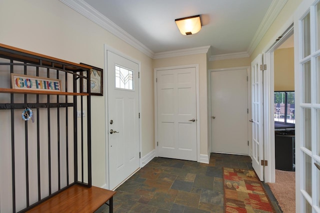 foyer entrance with dark stone finish floors, french doors, ornamental molding, and baseboards