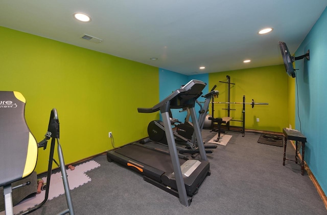 exercise area with recessed lighting and baseboards
