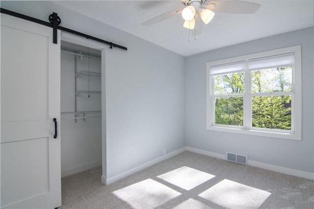 504 Wisconsin Ave, Frederic, WI 54837 - unfurnished bedroom featuring a closet, baseboards, and light carpet