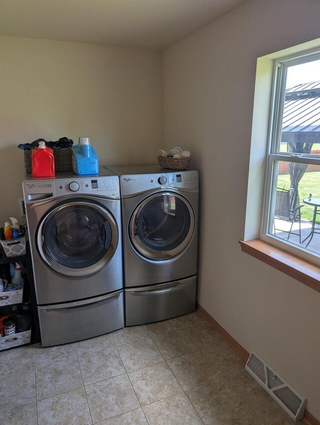 4374 Bent Grass Ct, Windsor, WI 53598 - washroom featuring washer and clothes dryer, light tile patterned floors, and baseboards