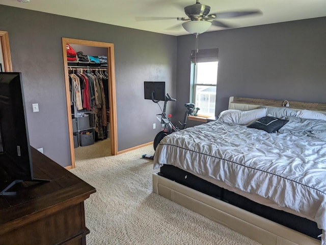 4374 Bent Grass Ct, Windsor, WI 53598 - carpeted bedroom featuring a walk in closet, a closet, baseboards, and ceiling fan