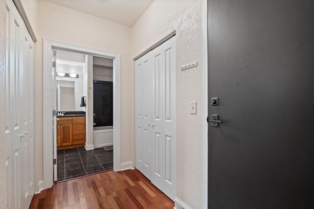 606 W Wisconsin Ave Unit 405, Milwaukee, WI 53203 - hallway with dark wood-style flooring