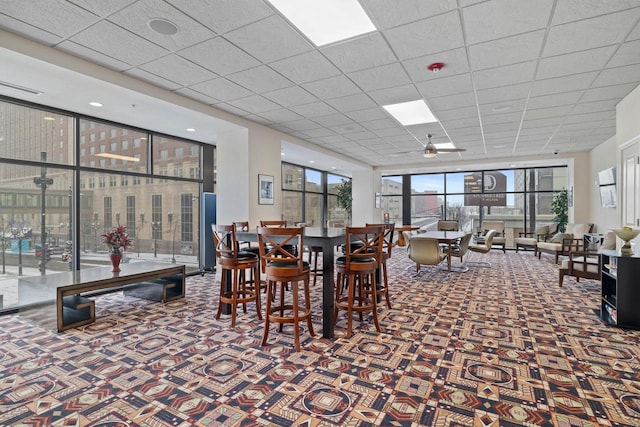 606 W Wisconsin Ave Unit 405, Milwaukee, WI 53203 - carpeted dining space with a paneled ceiling and a ceiling fan