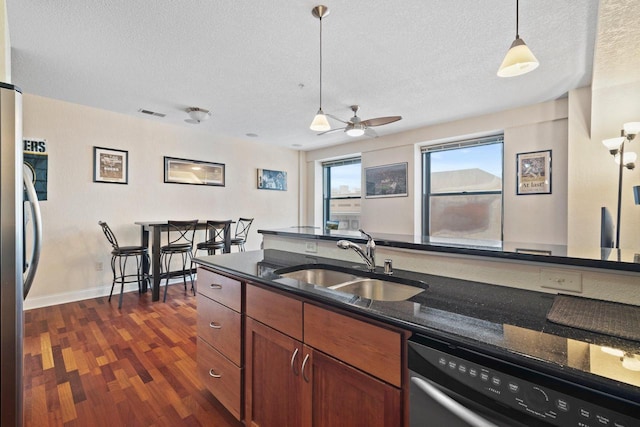 606 W Wisconsin Ave Unit 405, Milwaukee, WI 53203 - kitchen featuring dishwashing machine, a sink, freestanding refrigerator, a ceiling fan, and a textured ceiling