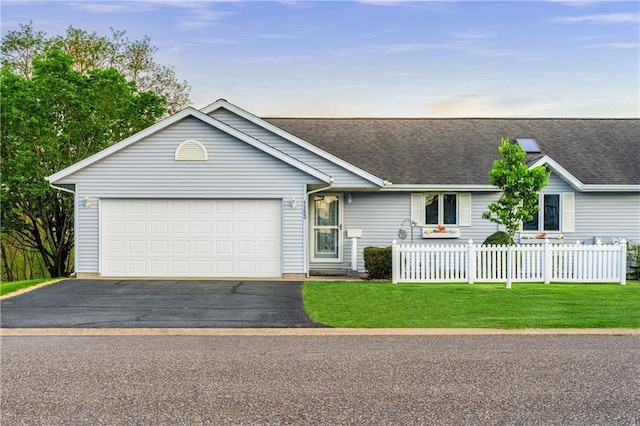 1153 Weather Ridge Rd, Chippewa Falls, WI 54729 - single story home featuring asphalt driveway, a garage, and roof with shingles