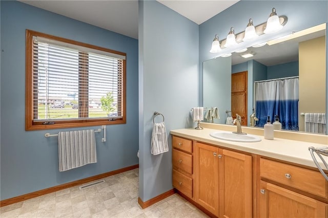 1153 Weather Ridge Rd, Chippewa Falls, WI 54729 - full bathroom featuring radiator heating unit, baseboards, and vanity