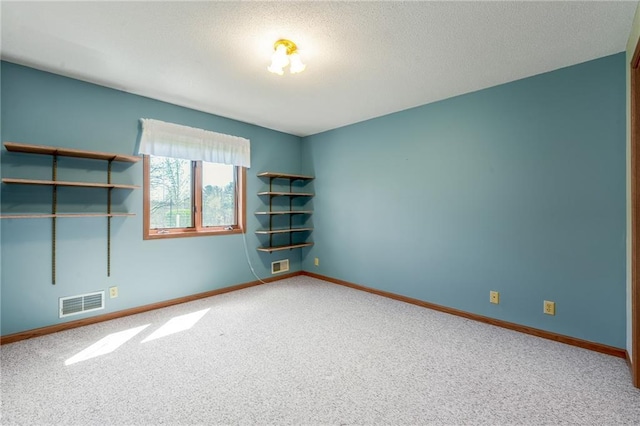 1153 Weather Ridge Rd, Chippewa Falls, WI 54729 - spare room with carpet floors, baseboards, and a textured ceiling
