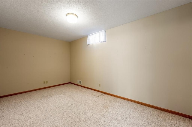 1153 Weather Ridge Rd, Chippewa Falls, WI 54729 - basement with light carpet, a textured ceiling, and baseboards