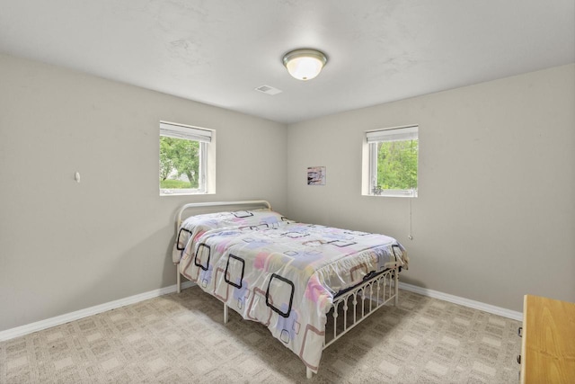 1959 S Cross Creek Cir, De Pere, WI 54115 - bedroom with multiple windows, baseboards, and carpet flooring
