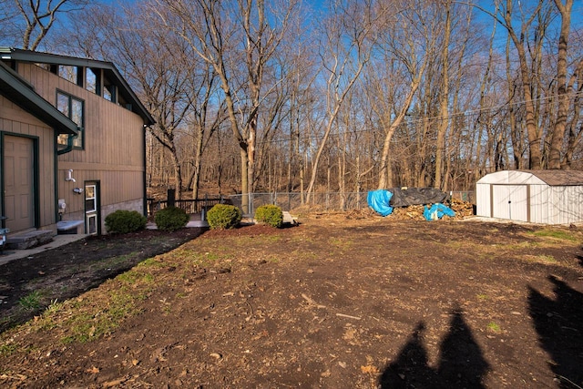 1031 N Osborne Blvd, Racine, WI 53405 - view of yard featuring fence, a storage unit, and an outdoor structure
