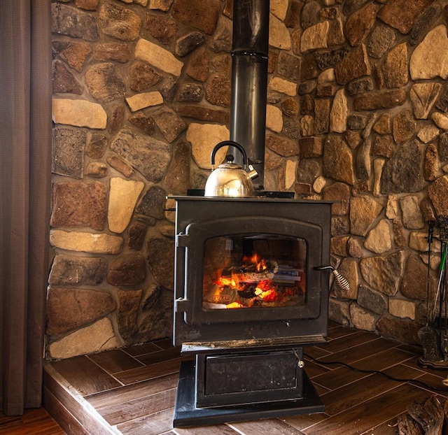 1031 N Osborne Blvd, Racine, WI 53405 - detailed view of wood finished floors and a wood stove