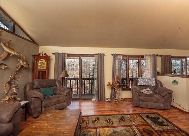 1031 N Osborne Blvd, Racine, WI 53405 - living area featuring vaulted ceiling, wood finished floors, and baseboards