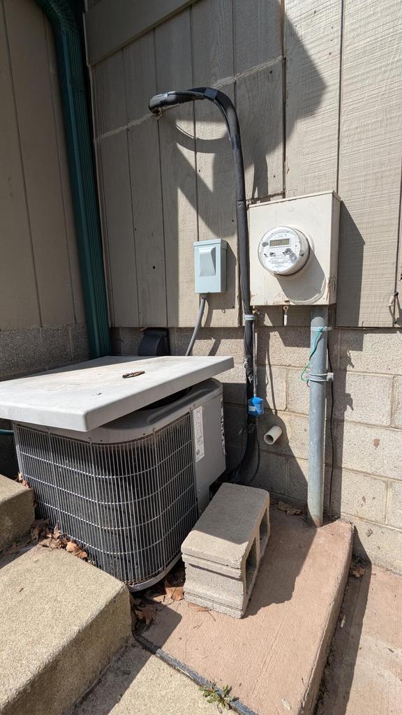 1031 N Osborne Blvd, Racine, WI 53405 - exterior view of electric meter and central AC unit