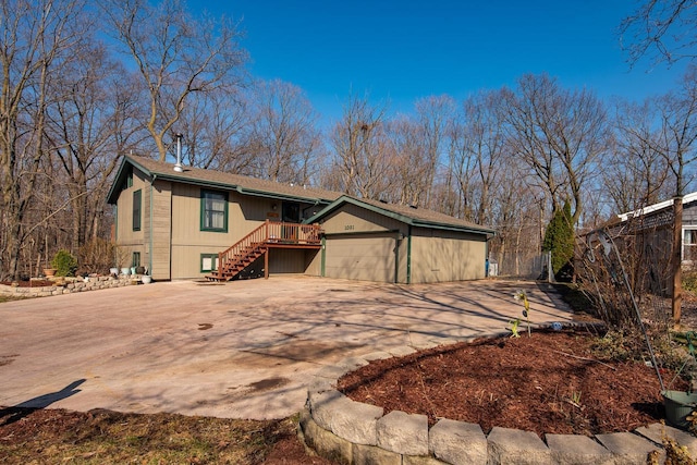 1031 N Osborne Blvd, Racine, WI 53405 - single story home with stairway, driveway, and a garage