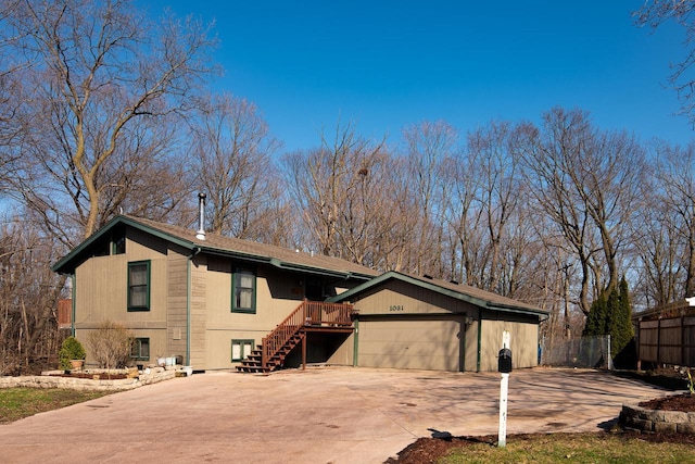 1031 N Osborne Blvd, Racine, WI 53405 - view of front of property featuring fence, stairway, and driveway
