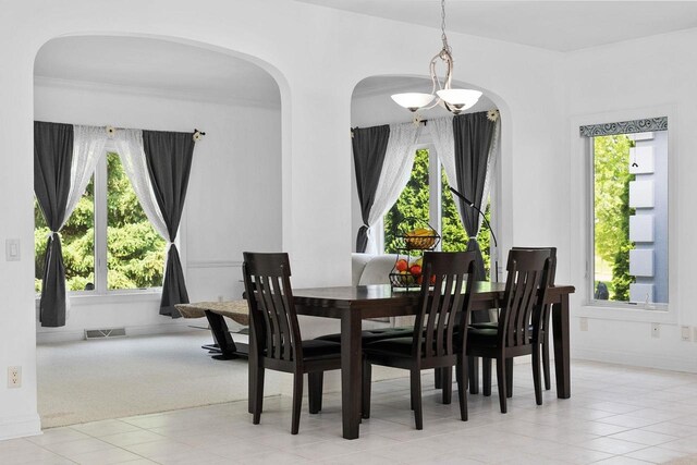 8705 Nelson Xing, Verona, WI 53593 - dining room with healthy amount of natural light, arched walkways, and tile patterned floors