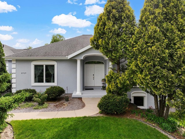 8705 Nelson Xing, Verona, WI 53593 - ranch-style house with a shingled roof, stucco siding, and a front lawn