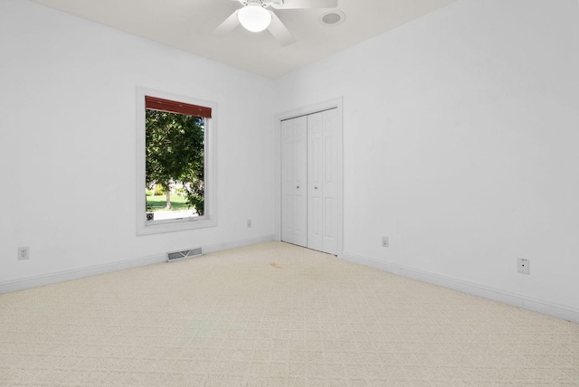8705 Nelson Xing, Verona, WI 53593 - unfurnished bedroom featuring light colored carpet, baseboards, ceiling fan, and a closet