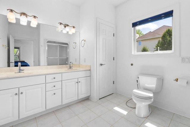 8705 Nelson Xing, Verona, WI 53593 - bathroom with a shower stall, toilet, double vanity, baseboards, and tile patterned floors
