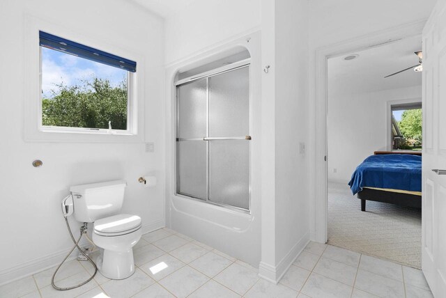 8705 Nelson Xing, Verona, WI 53593 - ensuite bathroom featuring baseboards, toilet, shower / bath combination with glass door, and tile patterned floors