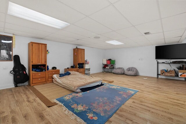 8705 Nelson Xing, Verona, WI 53593 - bedroom featuring light wood finished floors, a paneled ceiling, and baseboards
