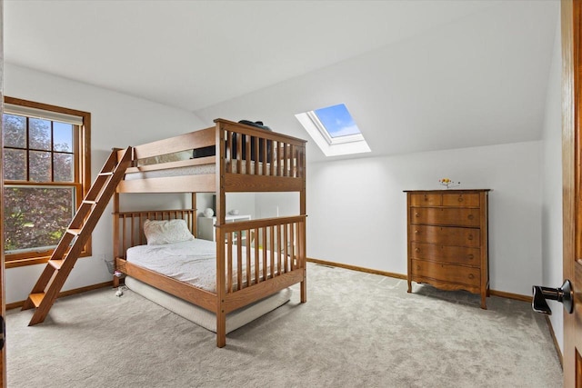 N39W32890 High Hill Ct, Nashotah, WI 53058 - carpeted bedroom with a skylight, baseboards, and vaulted ceiling