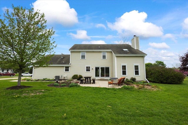 N39W32890 High Hill Ct, Nashotah, WI 53058 - back of property featuring a chimney, cooling unit, a lawn, and a patio