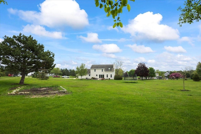 N39W32890 High Hill Ct, Nashotah, WI 53058 - view of grassy yard featuring a trampoline