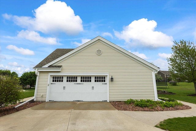 N39W32890 High Hill Ct, Nashotah, WI 53058 - view of side of home with concrete driveway, a garage, and a shingled roof