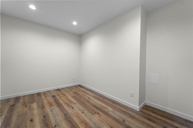 1407 Ridgetrail Dr, Cross Plains, WI 53528 - unfurnished room featuring baseboards, light wood finished floors, and recessed lighting