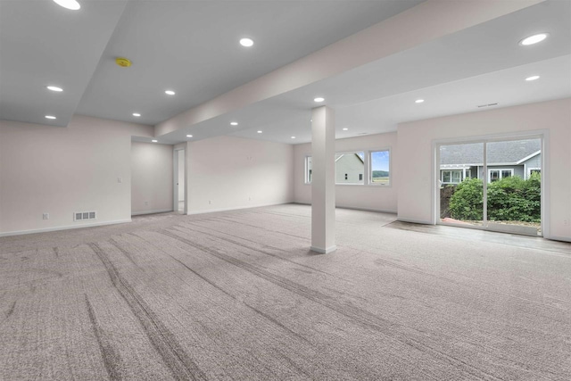 1407 Ridgetrail Dr, Cross Plains, WI 53528 - unfurnished living room featuring carpet, baseboards, and recessed lighting