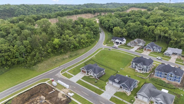 1407 Ridgetrail Dr, Cross Plains, WI 53528 - aerial view of property and surrounding area featuring a heavily wooded area and nearby suburban area