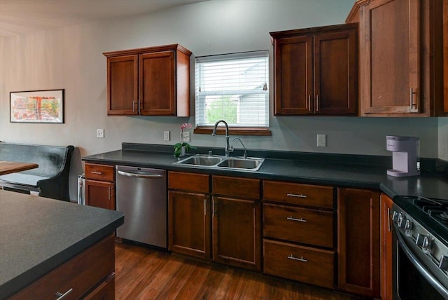 6972 Heirloom Dr, Deforest, WI 53532 - kitchen with a sink, stainless steel dishwasher, dark countertops, and dark wood-style flooring