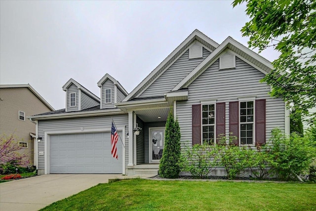 6972 Heirloom Dr, Deforest, WI 53532 - view of front of house featuring an attached garage, concrete driveway, and a front lawn