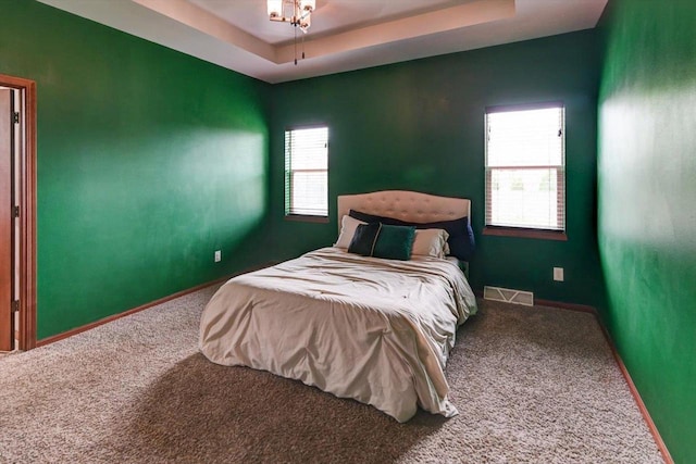 6972 Heirloom Dr, Deforest, WI 53532 - carpeted bedroom featuring baseboards and a tray ceiling