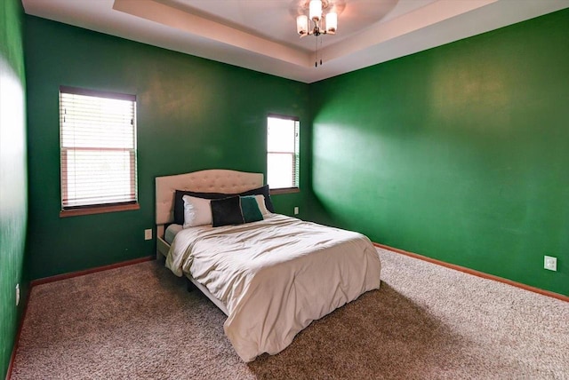 6972 Heirloom Dr, Deforest, WI 53532 - bedroom featuring carpet flooring, baseboards, and a tray ceiling