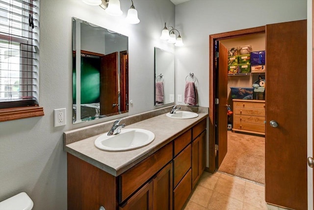 6972 Heirloom Dr, Deforest, WI 53532 - full bathroom featuring double vanity and toilet