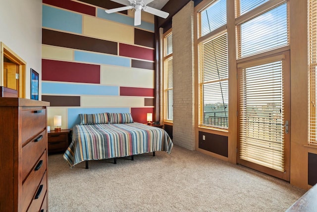 1325 N Van Buren St Unit 308, Milwaukee, WI 53202 - carpeted bedroom with multiple windows, a high ceiling, and access to exterior