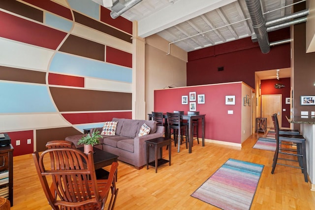 1325 N Van Buren St Unit 308, Milwaukee, WI 53202 - living room with a high ceiling, wood finished floors, and baseboards