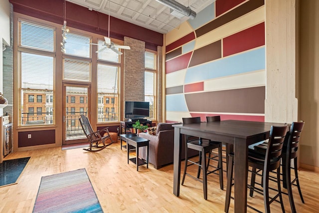 1325 N Van Buren St Unit 308, Milwaukee, WI 53202 - dining room featuring wood finished floors and ceiling fan