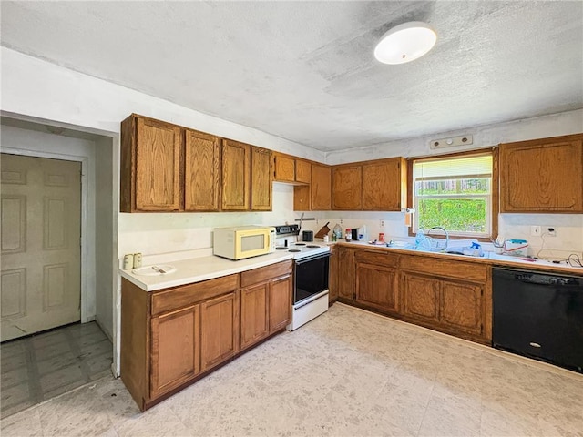 438 N Washington St, Saint Croix Falls, WI 54024 - kitchen featuring white appliances, a sink, brown cabinets, light flooring, and light countertops