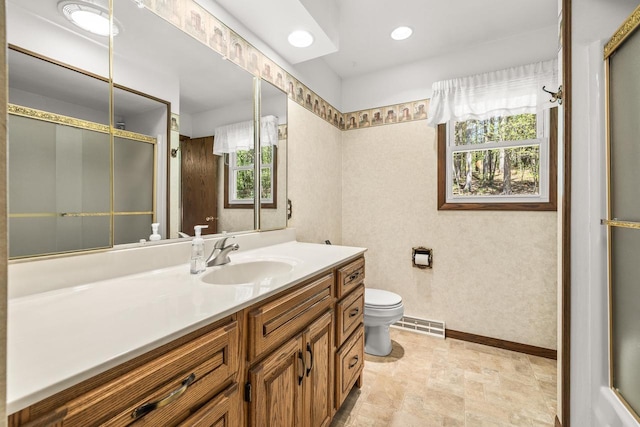 7256 State Highway 66, Custer, WI 54423 - bathroom featuring toilet, baseboards, vanity, and an enclosed shower