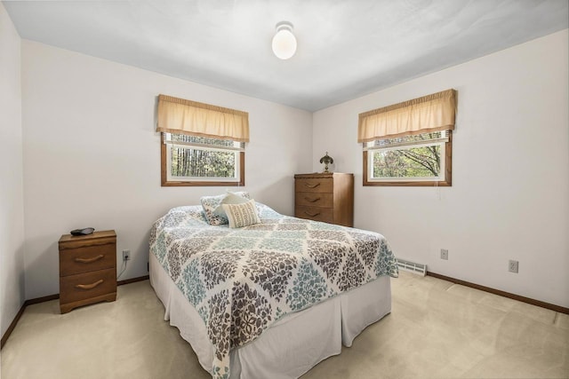 7256 State Highway 66, Custer, WI 54423 - bedroom featuring light colored carpet, multiple windows, and baseboards