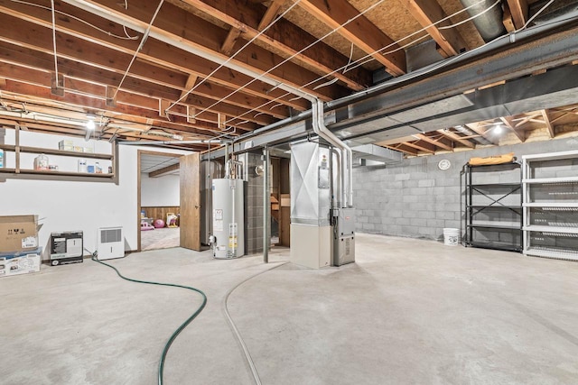 7256 State Highway 66, Custer, WI 54423 - unfinished basement with water heater and heating unit